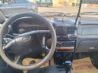 سياره كيا ريو 2002خالي قص قلبان قير اوتوماتيك منتهي ترخيصها الها 6شهورسعر البيع 5