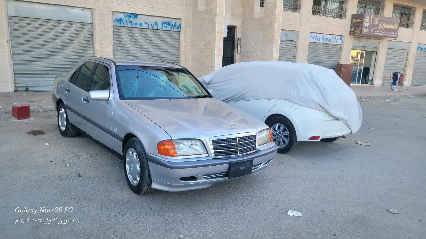 بسم الله الرحمن الرحيمللبيمرسيدس بنز C200 موديل 1997 أصلي لون سلفرماتور 2000cc ا